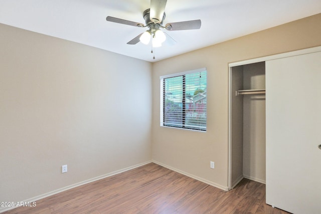 2112 E Donald Dr, Phoenix, AZ 85024 - unfurnished bedroom with wood finished floors, a closet, baseboards, and ceiling fan