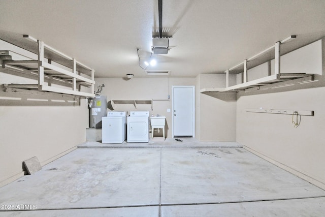 2112 E Donald Dr, Phoenix, AZ 85024 - garage with water heater, washer and dryer, and a sink