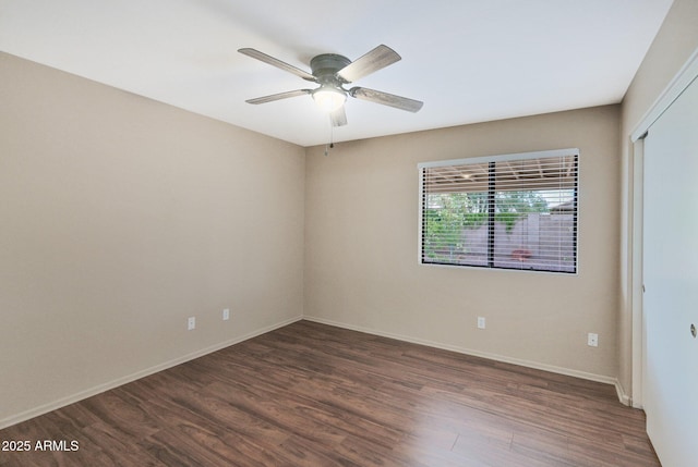 2112 E Donald Dr, Phoenix, AZ 85024 - empty room featuring dark wood-type flooring, a ceiling fan, and baseboards