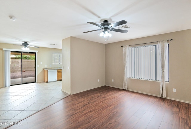 2112 E Donald Dr, Phoenix, AZ 85024 - unfurnished room with a ceiling fan, a smoke detector, light wood-type flooring, and baseboards
