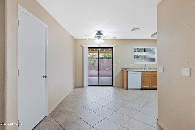 2112 E Donald Dr, Phoenix, AZ 85024 - kitchen featuring white dishwasher, a ceiling fan, a sink, light countertops, and light tile patterned floors