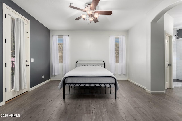 bedroom featuring dark wood-type flooring and ceiling fan