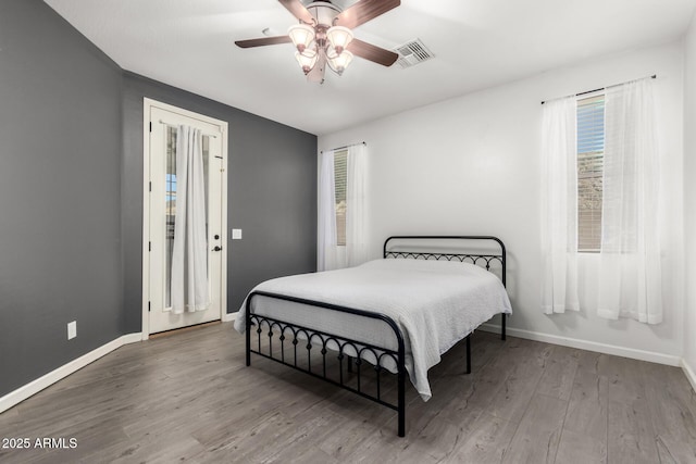 bedroom featuring ceiling fan and hardwood / wood-style flooring