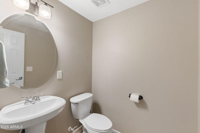 bathroom with toilet and sink