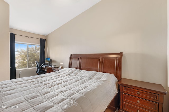 bedroom with lofted ceiling