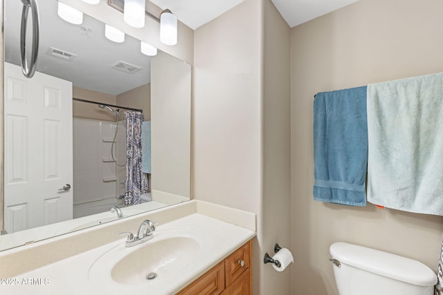 full bathroom with vanity, shower / bathtub combination with curtain, and toilet