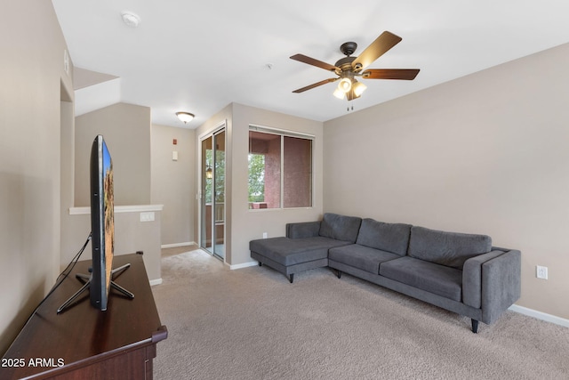 living room with light carpet and ceiling fan