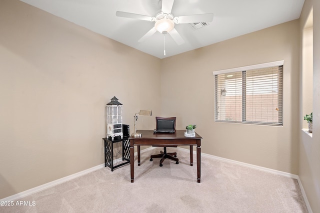 office with visible vents, light carpet, and baseboards