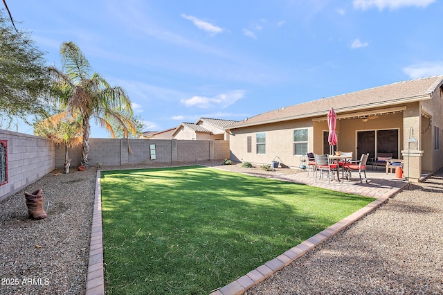 view of yard with a patio area and a fenced backyard