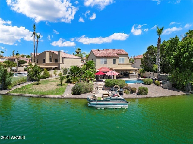 back of house featuring a water view