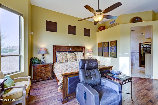 bedroom featuring a ceiling fan and wood finished floors