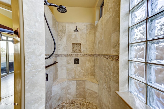 bathroom with tiled shower