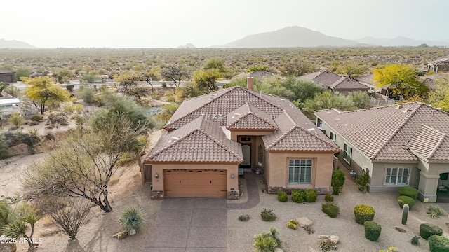 drone / aerial view featuring a mountain view