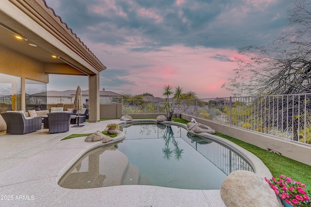 pool at dusk with a fenced in pool, a patio area, an outdoor living space, and a fenced backyard