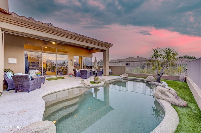 view of swimming pool featuring an outdoor living space, a patio area, and a fenced backyard