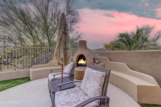 view of patio terrace at dusk