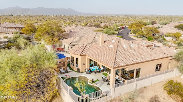 birds eye view of property featuring a mountain view