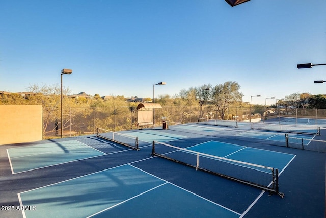 view of sport court with fence