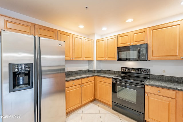 kitchen featuring dark countertops, black appliances, light tile patterned floors, and recessed lighting