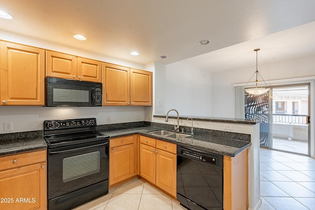 kitchen featuring a peninsula, hanging light fixtures, black appliances, a sink, and light tile patterned flooring