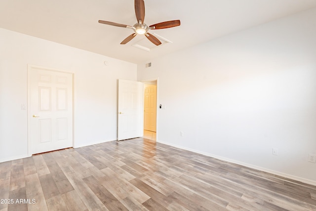 unfurnished bedroom with a ceiling fan, light wood-type flooring, visible vents, and baseboards