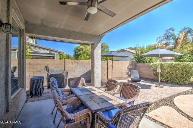 view of patio / terrace with ceiling fan and grilling area