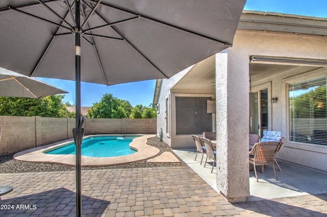 view of pool featuring a patio area