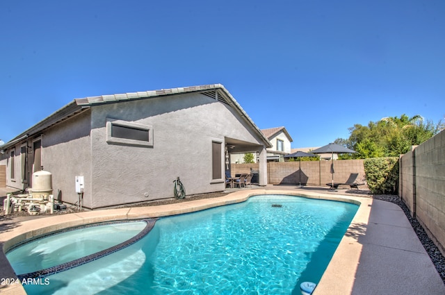 view of swimming pool with a patio area