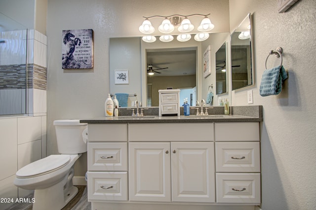 bathroom featuring ceiling fan, toilet, hardwood / wood-style flooring, and vanity