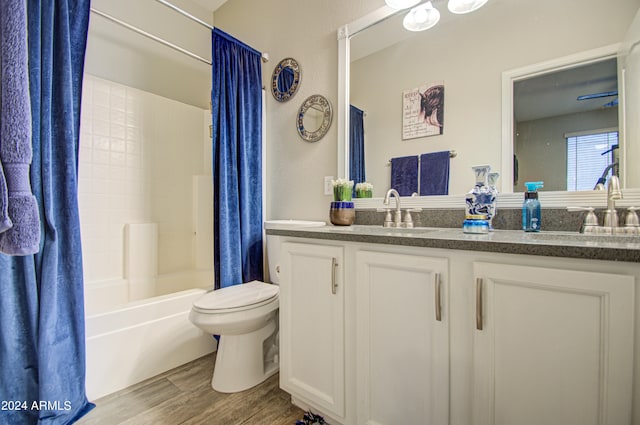 full bathroom featuring vanity, toilet, shower / tub combo, and hardwood / wood-style flooring