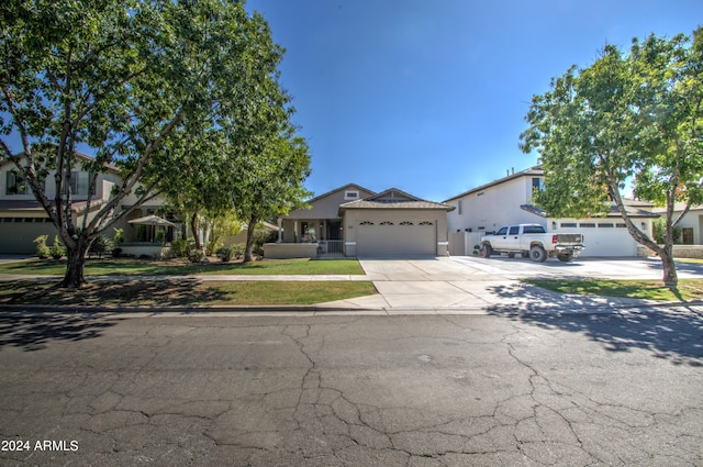 view of front facade featuring a front yard and a garage