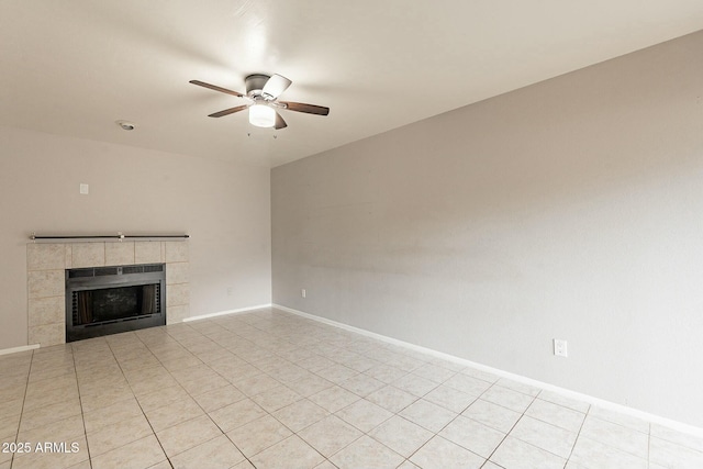 unfurnished living room featuring a fireplace, ceiling fan, and light tile patterned flooring