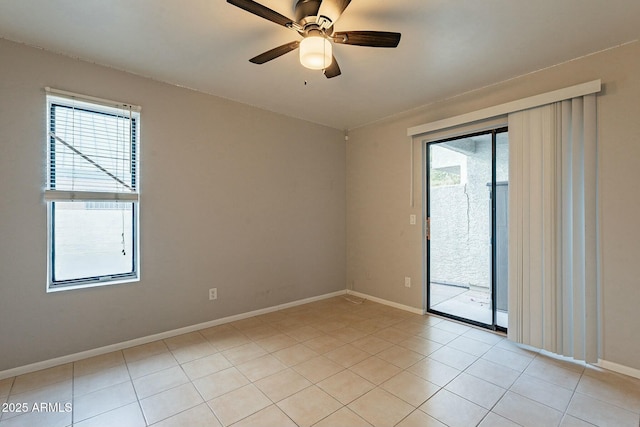 unfurnished room with light tile patterned floors and ceiling fan