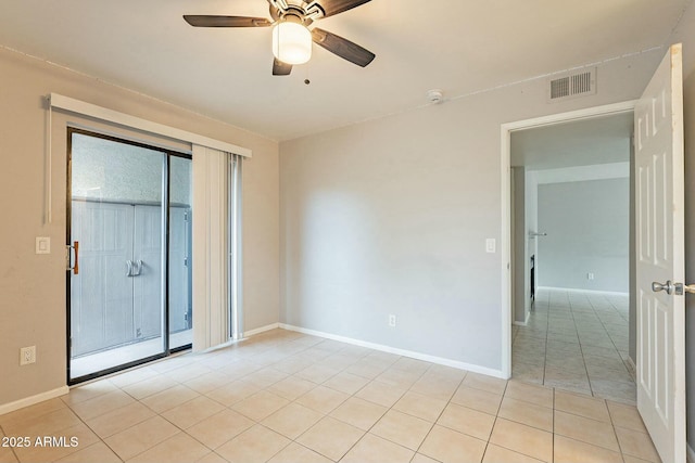 unfurnished room featuring light tile patterned floors and ceiling fan