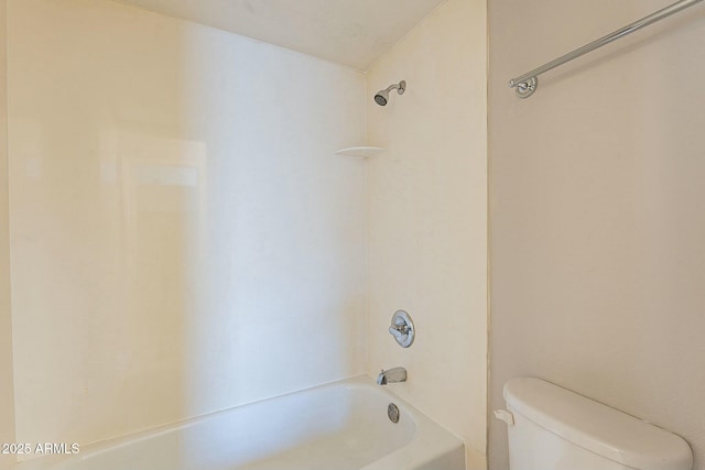 bathroom with shower / bathtub combination and toilet