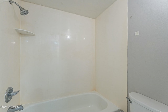 bathroom featuring toilet and shower / bathtub combination