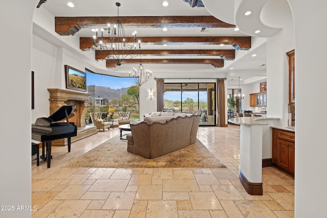 living room with beamed ceiling and a chandelier