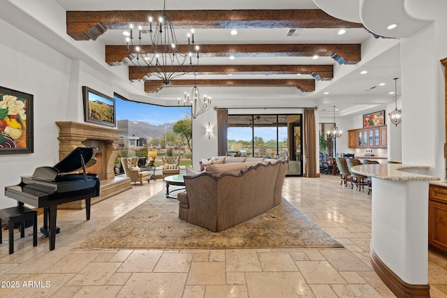 living room with beam ceiling and a chandelier