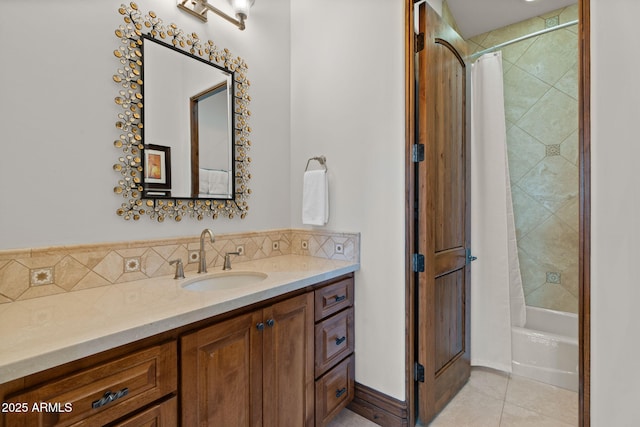 bathroom featuring vanity, tasteful backsplash, tile patterned floors, and shower / bath combo