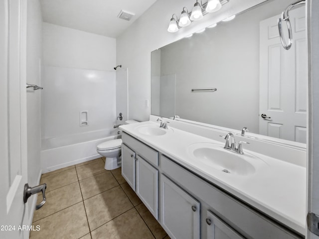 full bathroom featuring vanity, bathing tub / shower combination, toilet, and tile patterned flooring