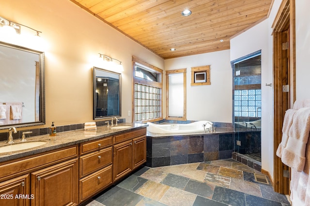 bathroom with a sink, wood ceiling, a bath, and double vanity