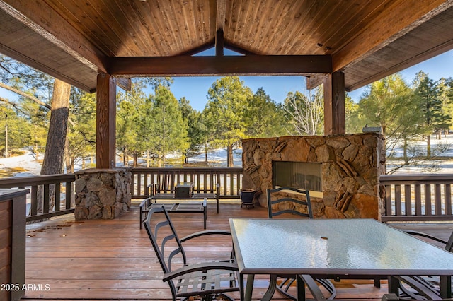 wooden deck featuring outdoor dining area