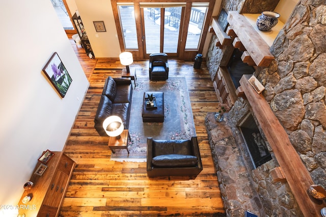 unfurnished living room featuring hardwood / wood-style floors and a fireplace