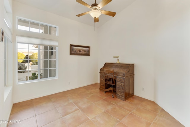 interior space featuring ceiling fan and light tile patterned floors