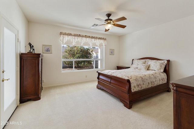 bedroom featuring ceiling fan and light colored carpet