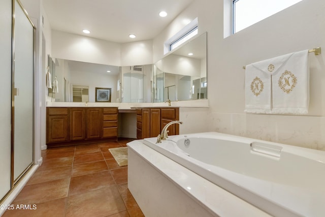 bathroom featuring independent shower and bath, tile patterned flooring, vanity, and a high ceiling