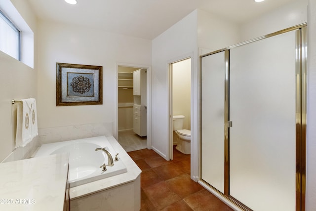 bathroom featuring toilet, tile patterned flooring, and independent shower and bath