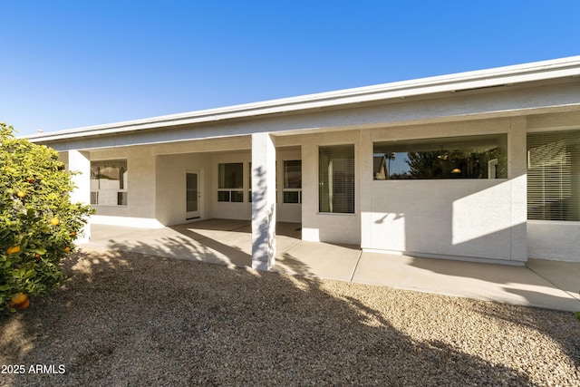 rear view of house featuring a patio