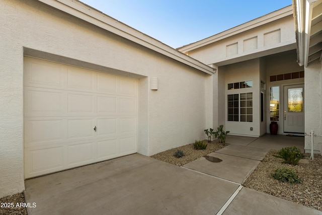 property entrance with a garage