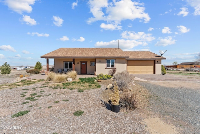 single story home with a garage